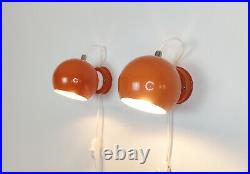 Pair of mid century atomic eyeball lamps, orange globe lights. Scandinavian