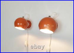 Pair of mid century atomic eyeball lamps, orange globe lights. Scandinavian