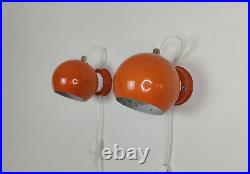 Pair of mid century atomic eyeball lamps, orange globe lights. Scandinavian