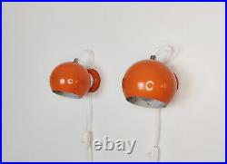 Pair of mid century atomic eyeball lamps, orange globe lights. Scandinavian