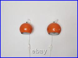 Pair of mid century atomic eyeball lamps, orange globe lights. Scandinavian