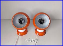 Pair of mid century atomic eyeball lamps, orange globe lights. Scandinavian