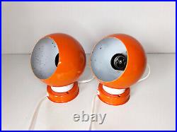 Pair of mid century atomic eyeball lamps, orange globe lights. Scandinavian