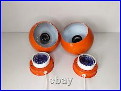 Pair of mid century atomic eyeball lamps, orange globe lights. Scandinavian