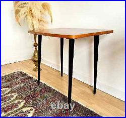 Vintage mid century modern wooden side table with black atomic legs 1970s